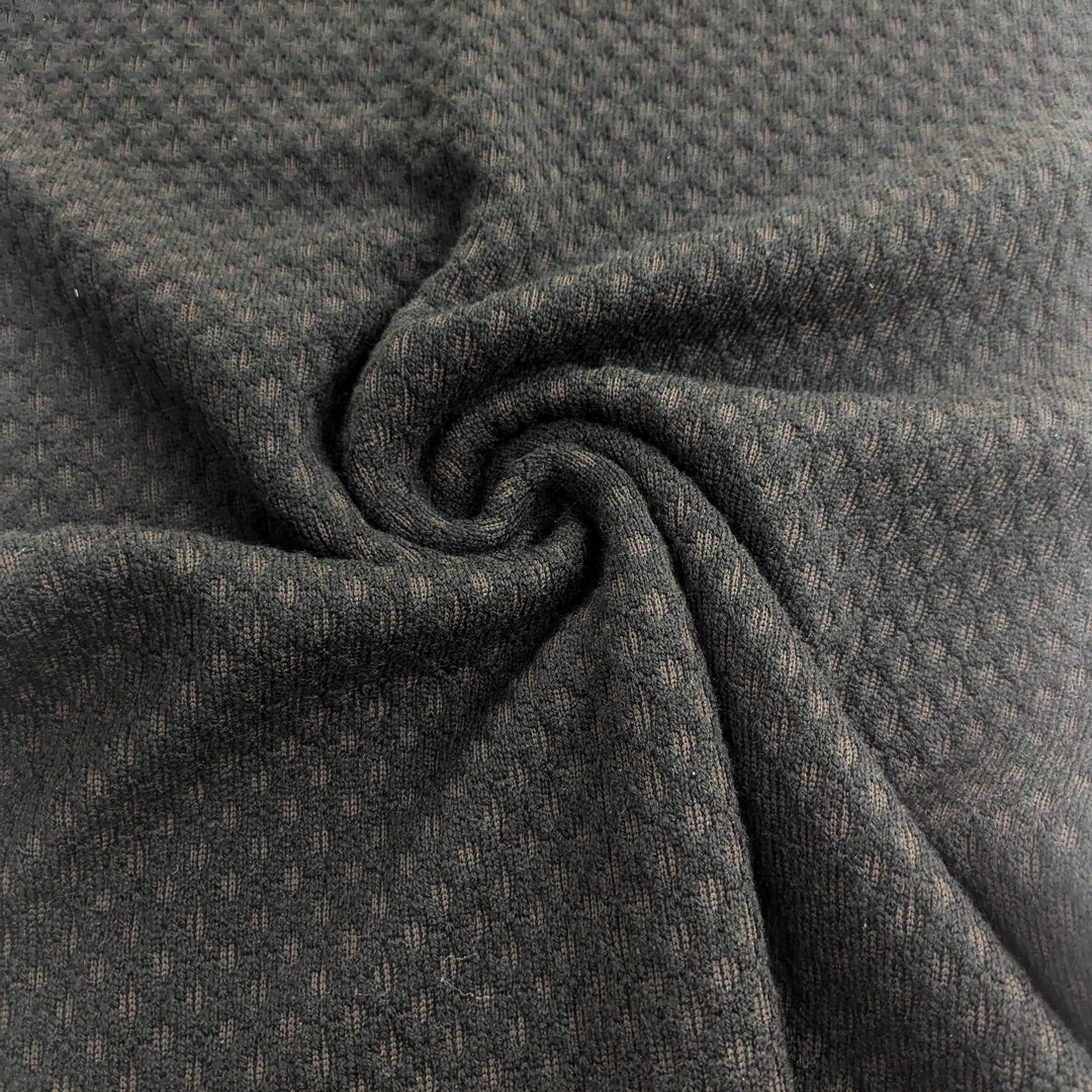 Tissu tricoté noir « Boing »